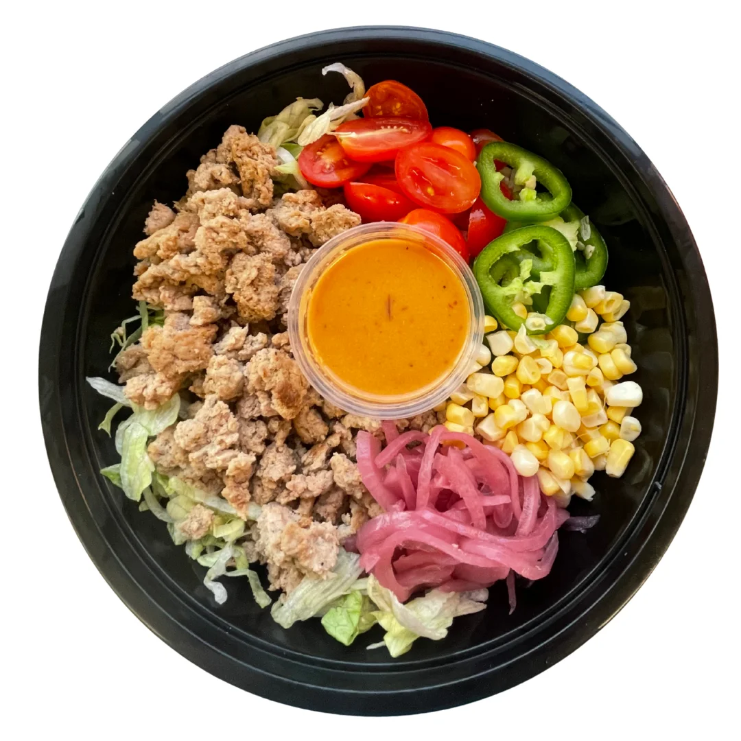Mexican taco salad with seasoned meat and fresh toppings