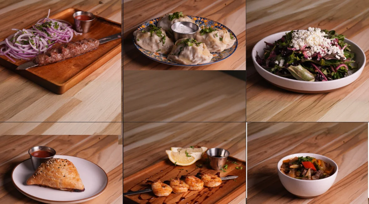 Assorted South Asian dishes including kebabs and dumplings