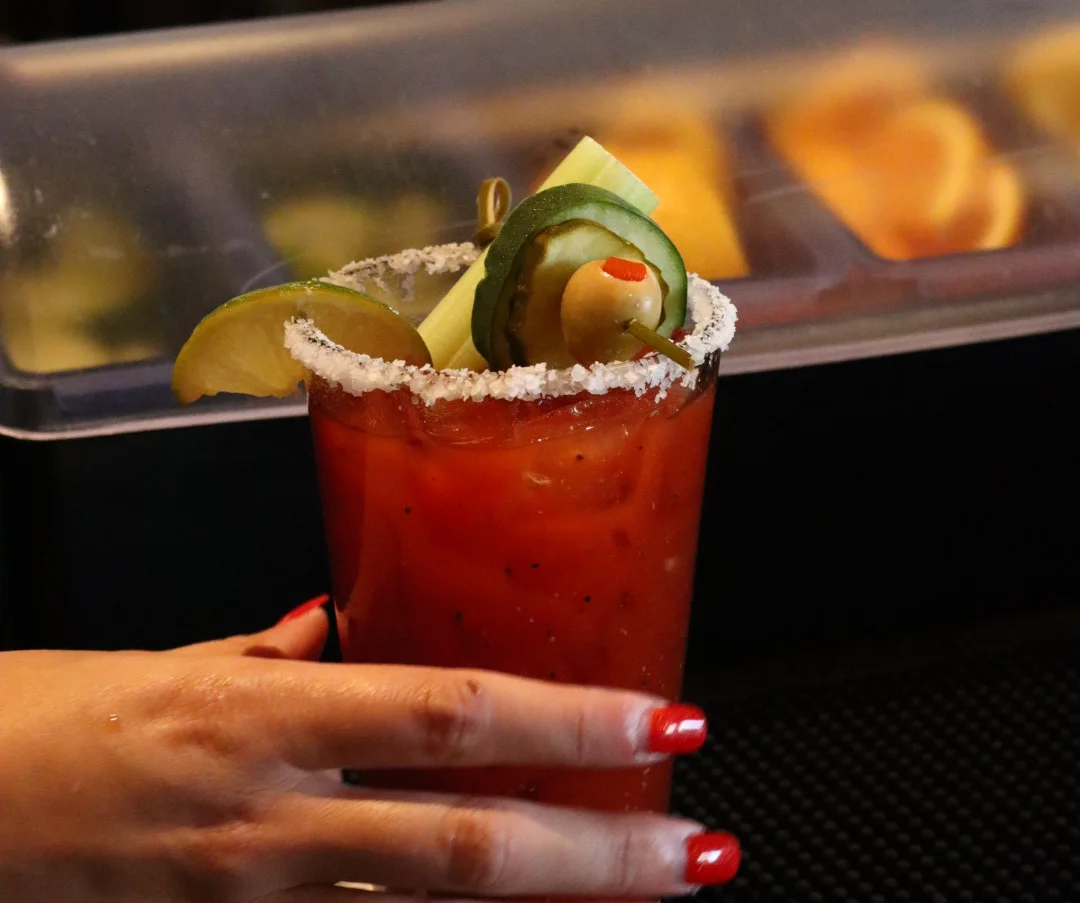Classic Bloody Mary cocktail garnished with celery and olives