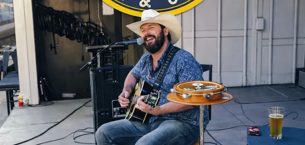 Live music event at Nacho Average Bar & Grill featuring a guitarist