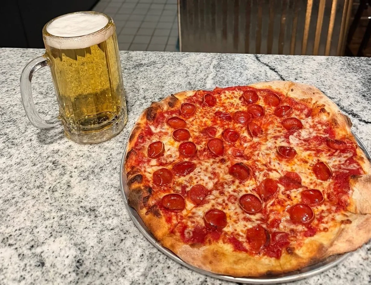 Pepperoni pizza served with a cold beer