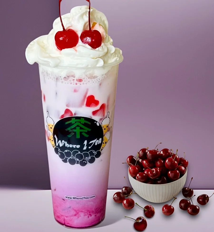 Colorful cherry milk tea topped with whipped cream