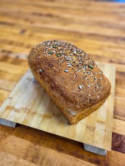 Freshly baked artisan bread loaf with seeds