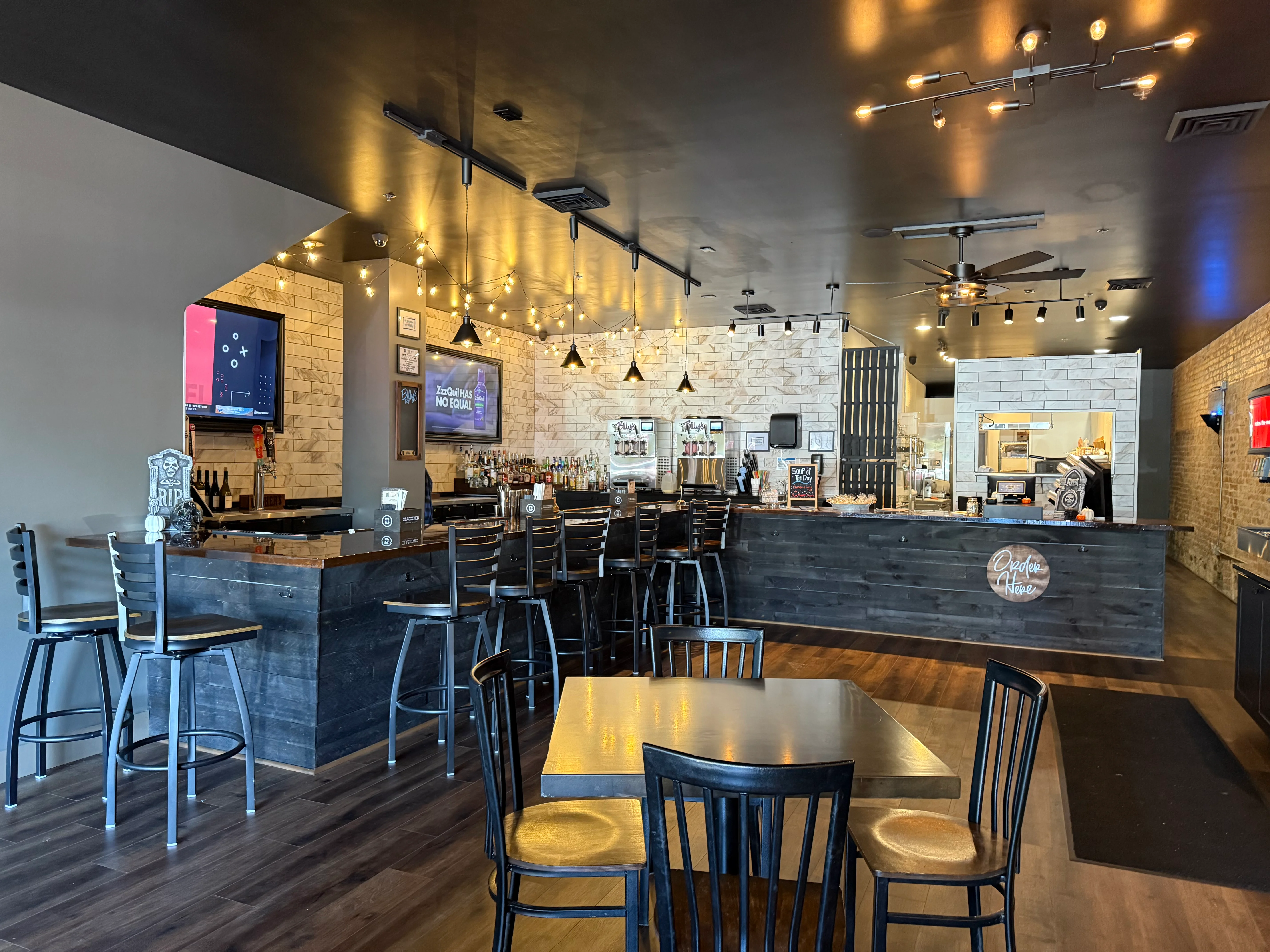 Modern restaurant interior with bar and warm lighting