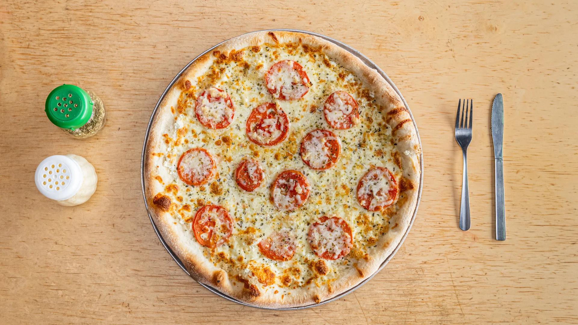 Classic Margherita pizza with fresh tomatoes and cheese