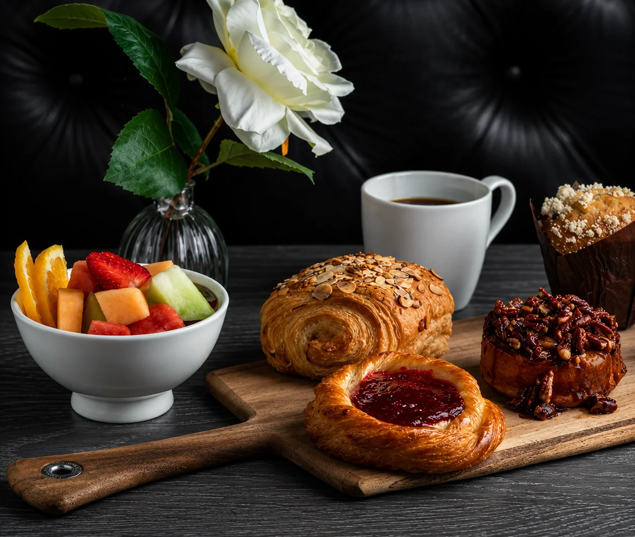 A variety of fresh baguettes displayed on a wooden board.