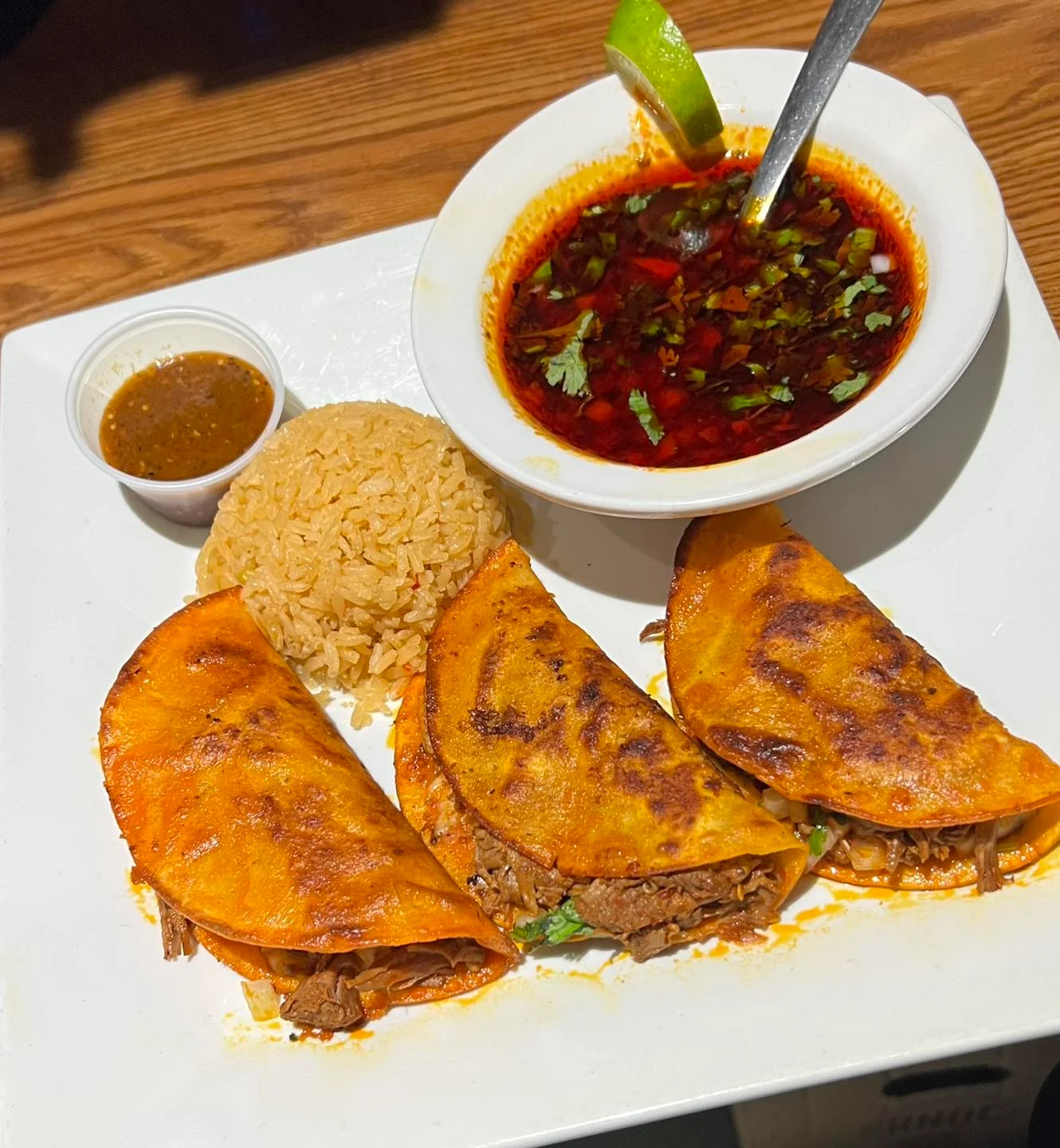 Authentic Mexican tacos with consomé and rice
