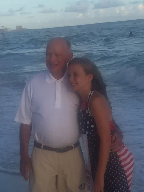 Pictured: Corky McGowan with his only granddaughter, Kinslee McGowan