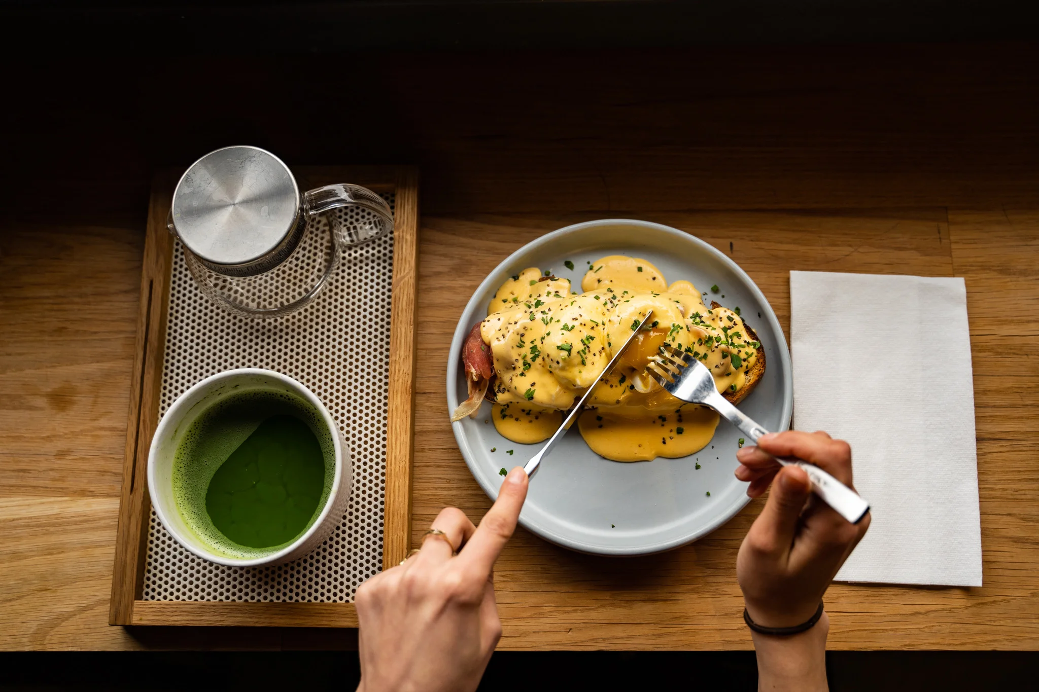 Eggs Benedict served with green tea