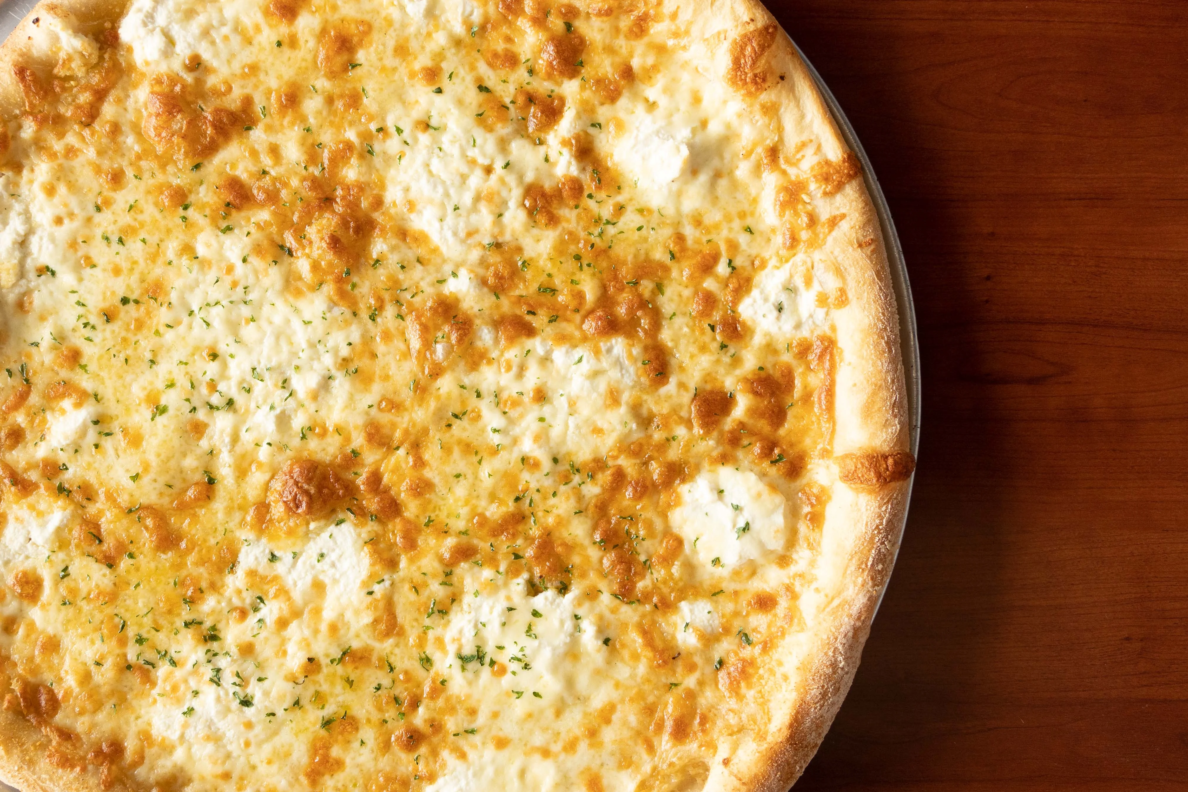 Cheesy white pizza with a golden crust
