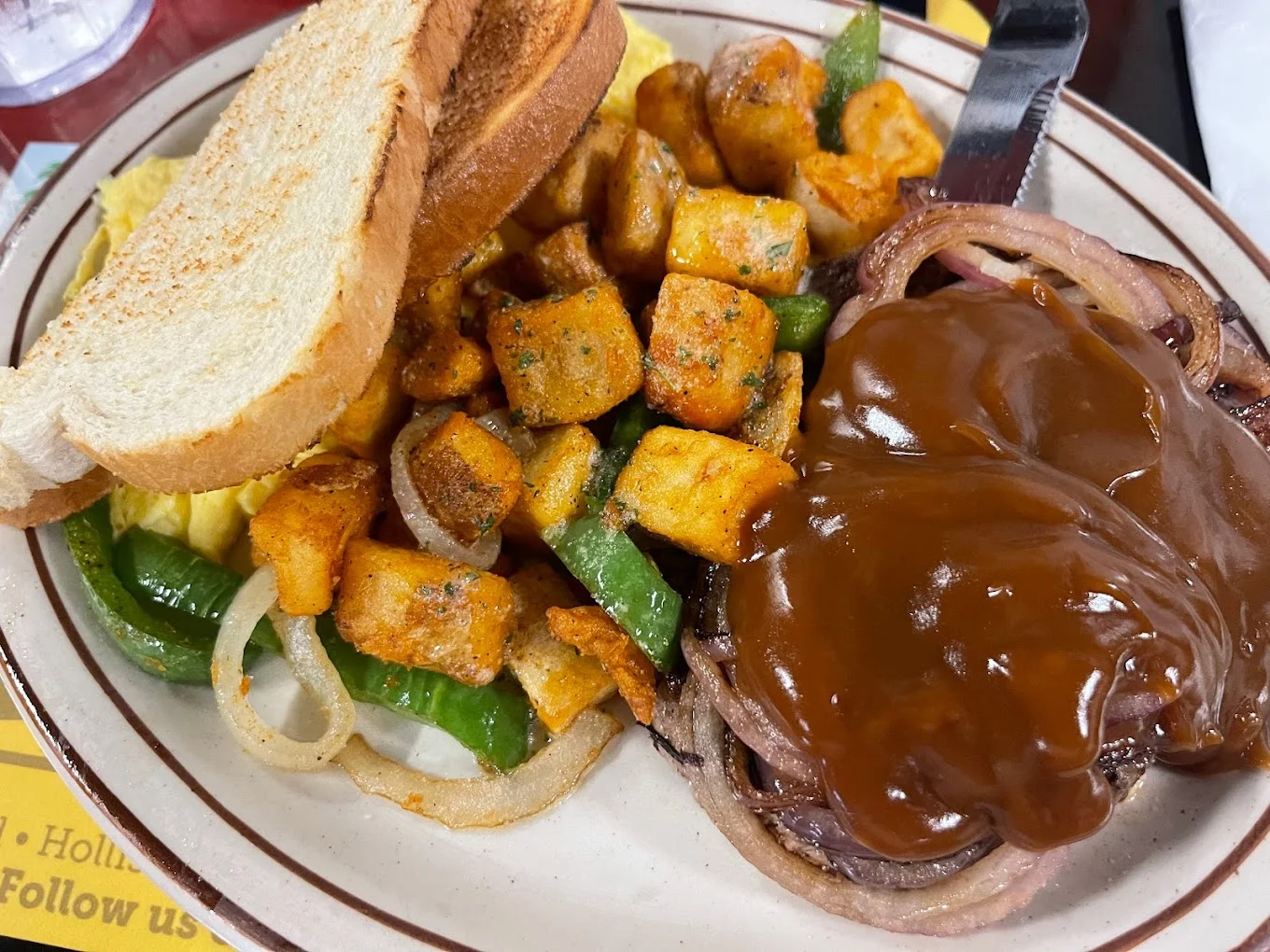 Hearty American country breakfast platter with toast and potatoes