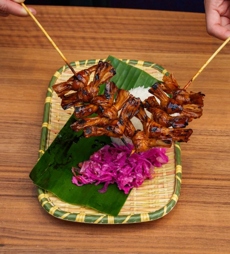 Grilled Indonesian satay skewers with pickled vegetables