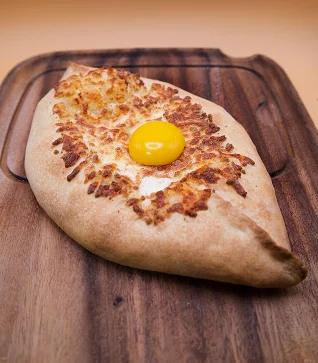 Georgian khachapuri with a runny egg yolk