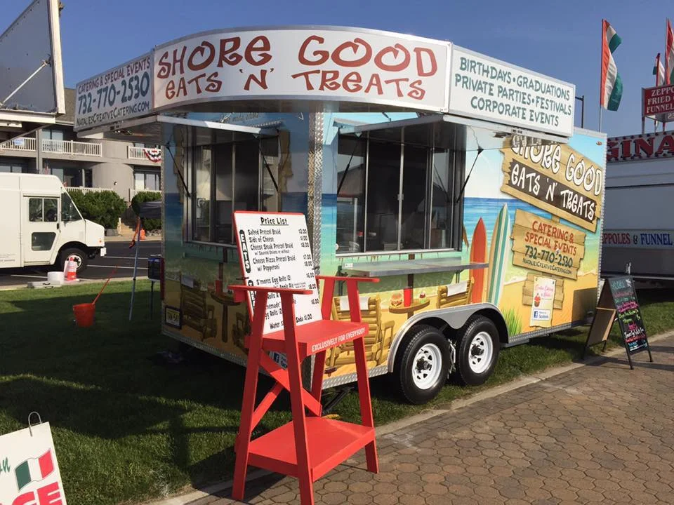 Colorful food truck offering catering services and treats