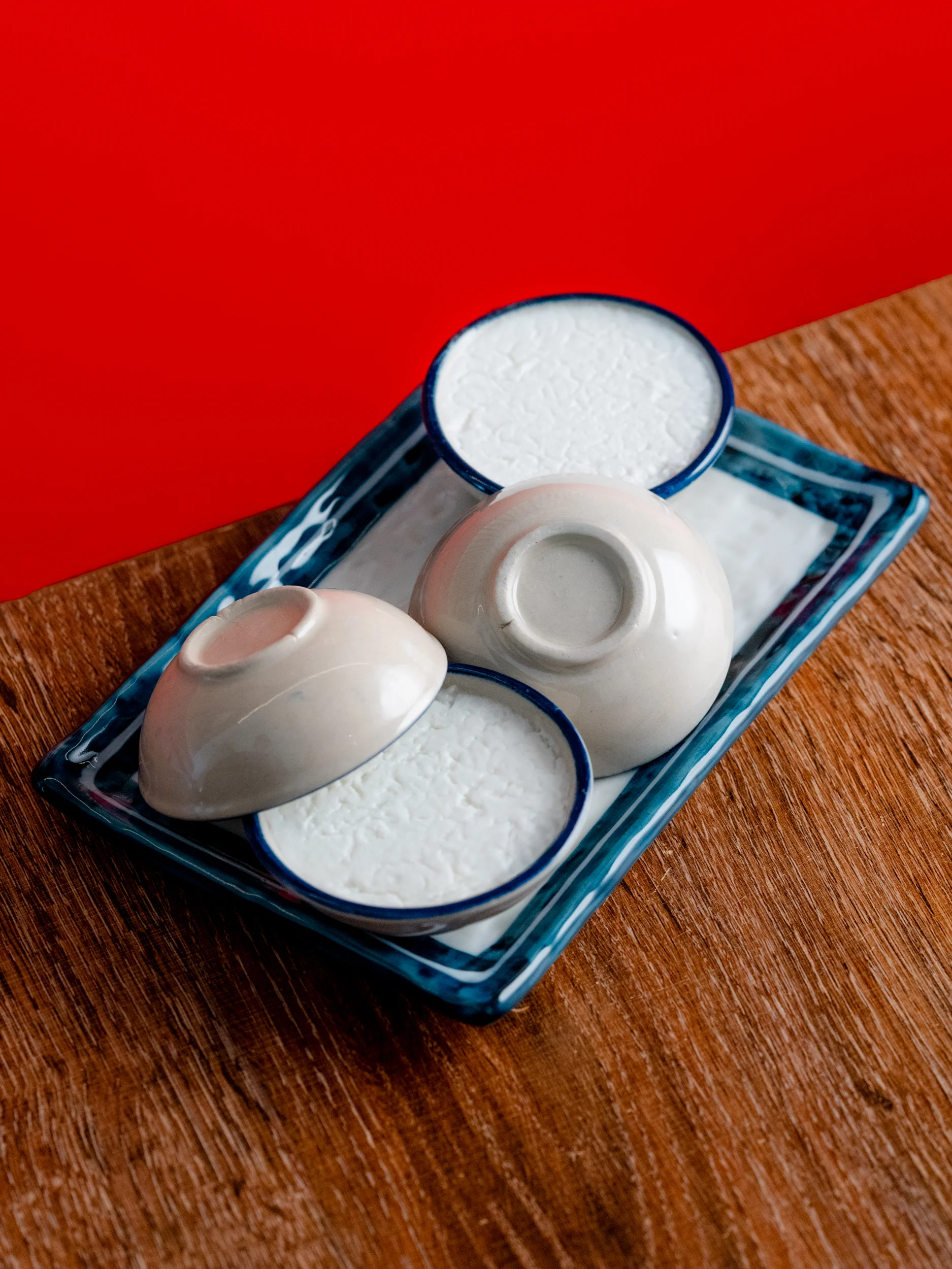 Traditional Japanese rice bowls on a decorative plate
