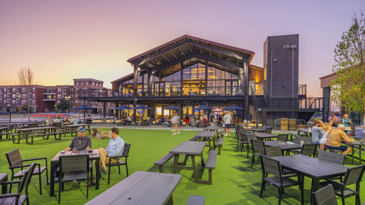Modern restaurant patio with outdoor seating at sunset