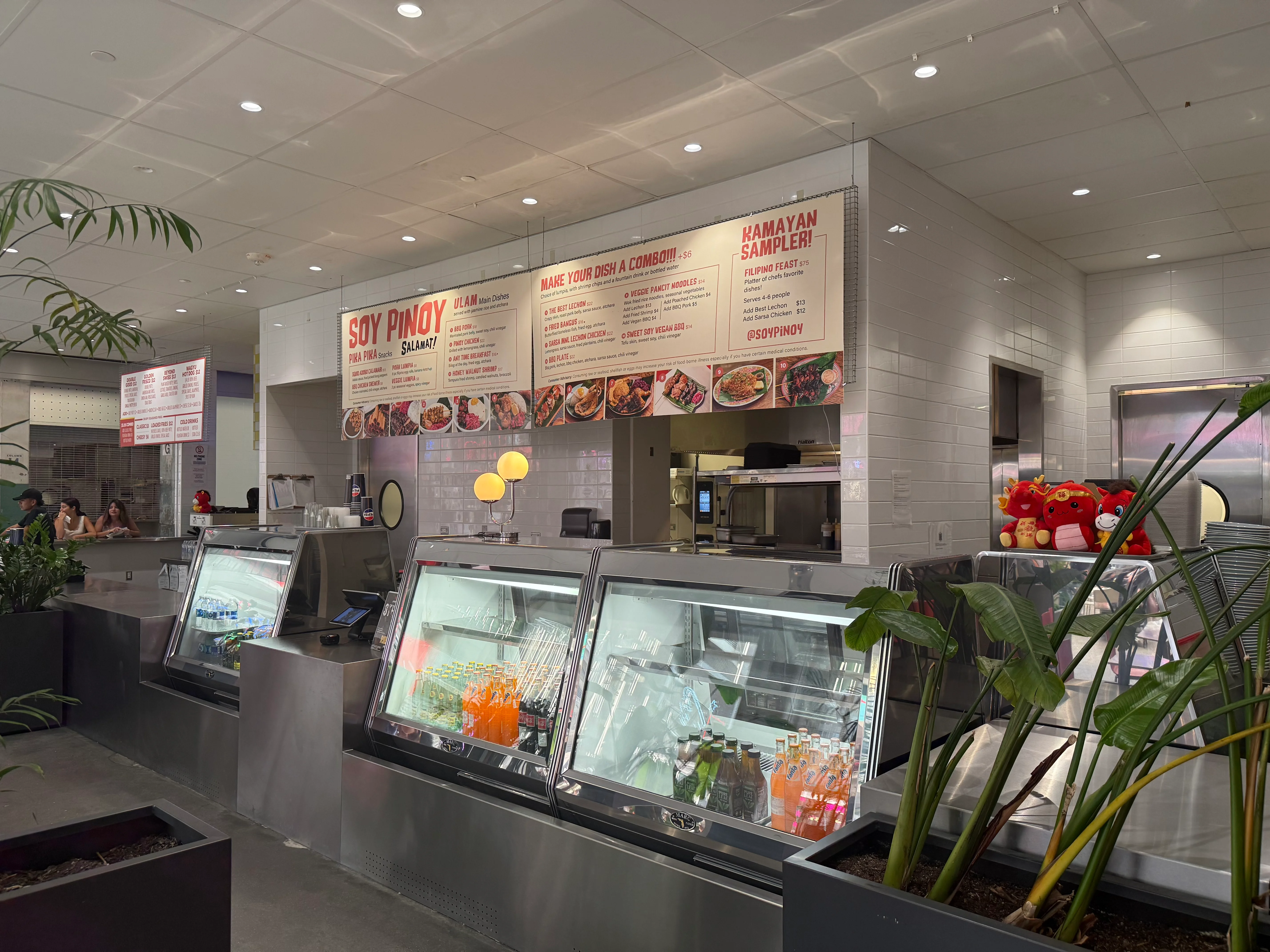 Soy Pinoy counter with Filipino cuisine menu and display cases