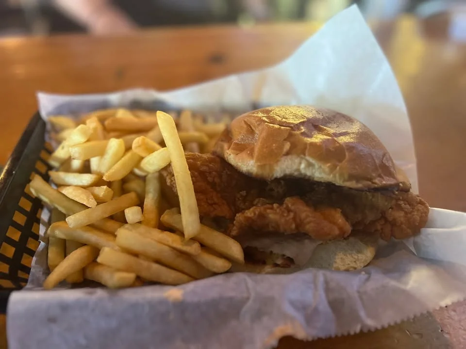 Crispy fried chicken sandwich with fries