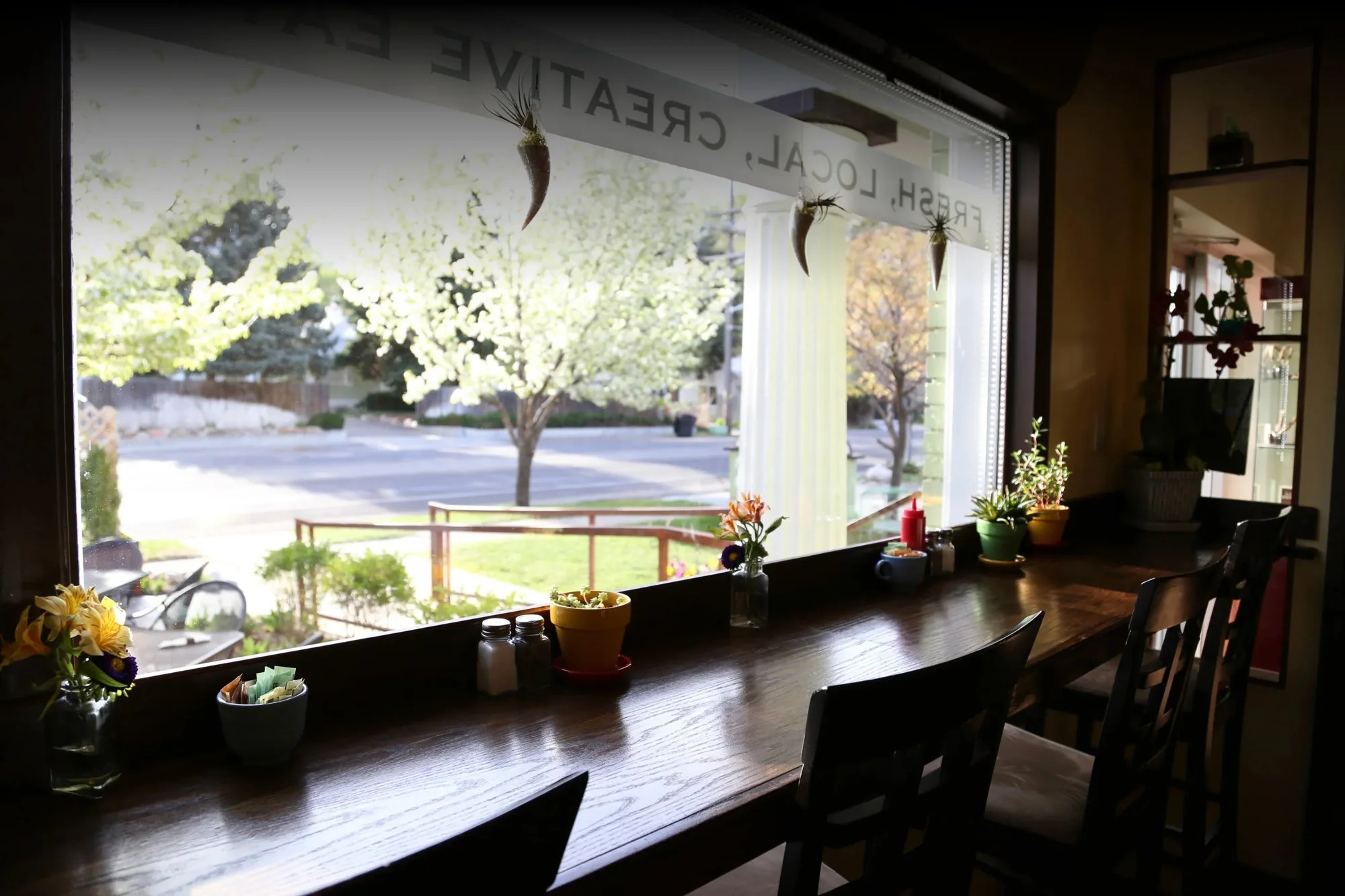 The front window at Roots Cafe in East Millcreek