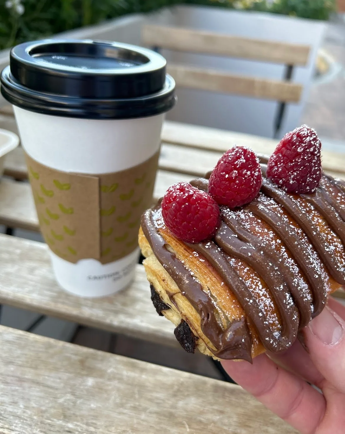 Decadent chocolate croissant with raspberries