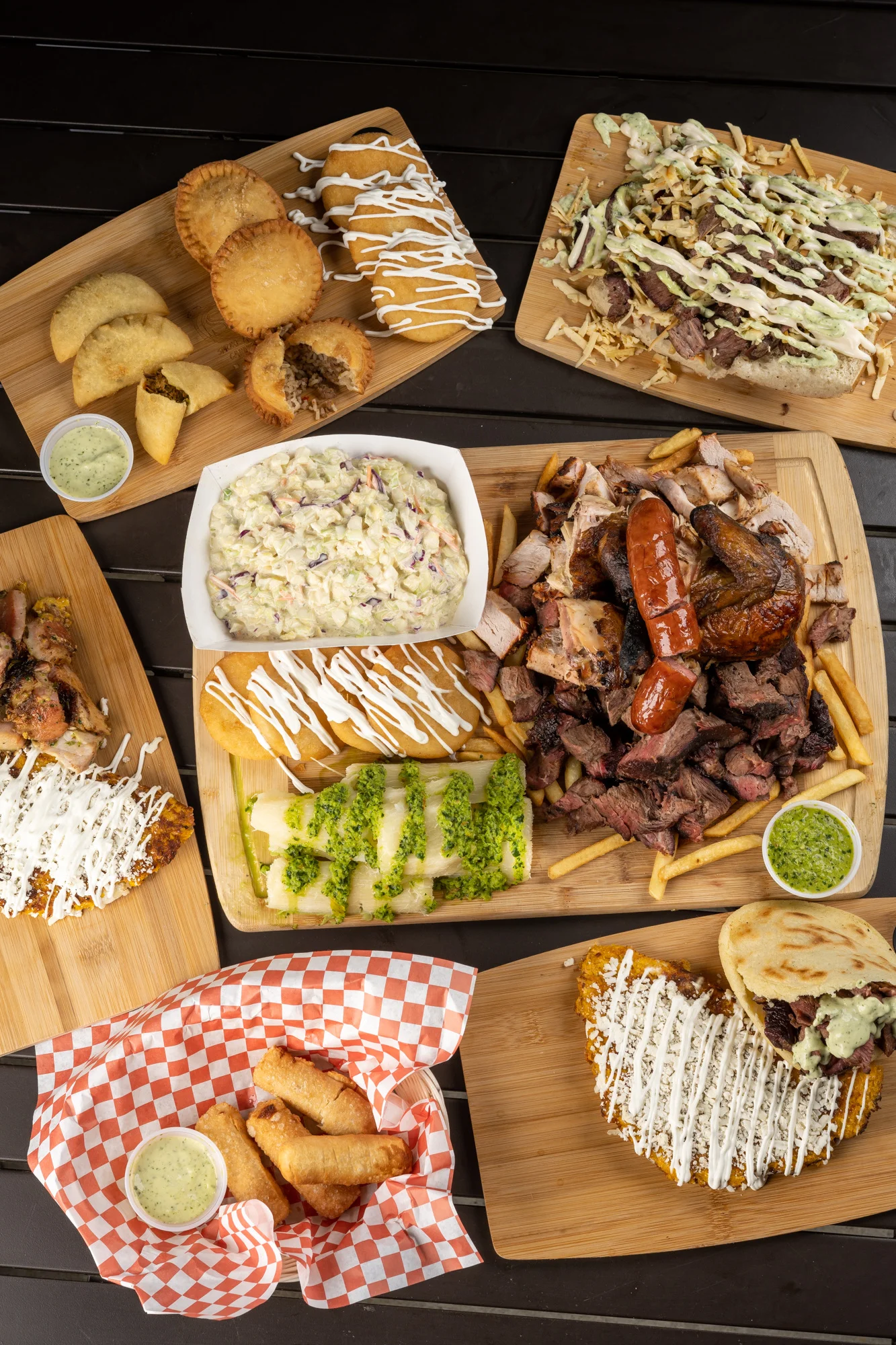 Assorted barbecue platter with sides and empanadas