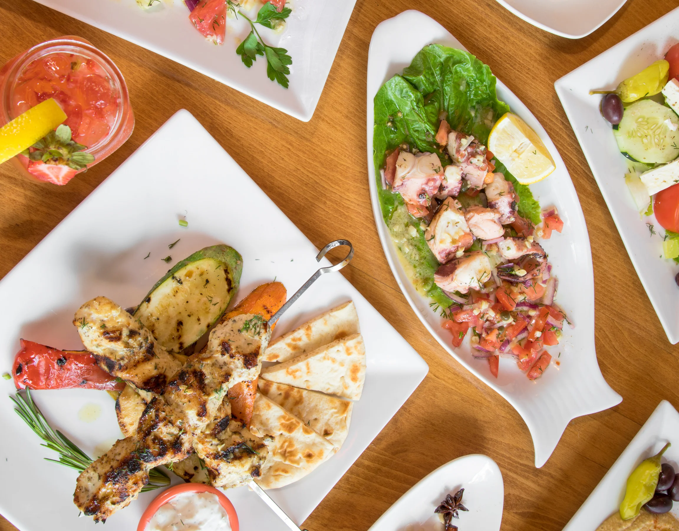 Mixed grill platter featuring kebabs and shrimp